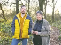  ??  ?? ‘Travesty’: campaigner­s Jack Taylor and Helen Franklin in Glyn Davies Wood. Below, a protest sign hanging from a tree