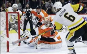  ?? MATT SLOCUM — THE ASSOCIATED PRESS ?? Philadelph­ia Flyers’ Michal Neuvirth (30) cannot stop a goal by Pittsburgh Penguins’ Jamie Oleksiak (6) during the third period of an NHL hockey game, Tuesday in Philadelph­ia. Pittsburgh won 5-1.