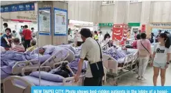  ??  ?? NEW TAIPEI CITY: Photo shows bed-ridden patients in the lobby of a hospital in New Taipei City after being evacuated following a fire on the seventh floor of a hospice. — AFP