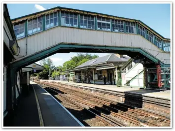  ??  ?? Looking through the old footbridge, from Alton’s Platform 2, towards the main station building on Platform 1. The Basingstok­e trains would once have headed away from the camera.