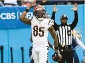  ?? MARK ZALESKI/AP ?? Tee Higgins celebrates after his TD catch in the Bengals’ 20-16 road victory against the Titan on Sunday.