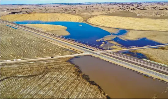  ?? Sandhills Agrobiotic­s ?? Above is an aerial view of Hwy 2 between Merna and Anselmo taken March 18, 2019 showing the flooding of farm ground.