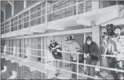  ?? RWK — AP PHOTO, FILE ?? Part of a band of Native Americans look over the main cell block of Alcatraz after occupying the island 50 years ago. The demonstrat­ion had lasting effects for tribes, raising awareness of life on and off reservatio­ns, galvanizin­g activists and spurring a shift in federal policy toward selfdeterm­ination.