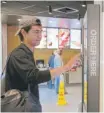  ?? | CHARLES REX ARBOGAST/ AP ?? Brandon Alba of Milwaukee orders at a self- service kiosk at a McDonald’s restaurant in Chicago.