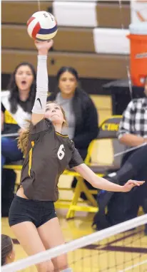  ?? GREG SORBER/JOURNAL ?? Cibola’s Emma White hits the ball during the Cougars’ win over Volcano Vista Tuesday. Cibola (12-4, 5-1 in District 1-5A) solidified its hold on first place with the four-set win over the Hawks, who fell to 11-4 overall, 3-2 in district play.