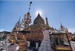  ??  ?? The Shwezigon Pagoda is the prototype of Burmese stupas, with a bell-shaped gilded central stupa surrounded by smaller temples and shrines. It was built by King Anawrahta and finished during the subsequent reign during the 11th-12th century, and is...