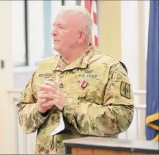  ?? Ryan Campbell / New York Army National Guard ?? Sgt. 1st Class Paul Mulligan speaks during his retirement ceremony at New York National Guard Headquarte­rs.