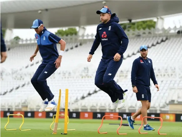  ?? Gareth Copley / Getty Images ?? Joe Root, centre, and Stuart Broad warm up at Trent Bridge before the second Test against South Africa. England won the first Test by 211 runs