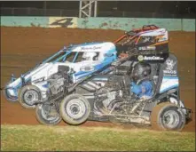  ?? CARL HESS - FOR DIGITAL FIRST MEDIA ?? Here’s some close three-wide action in the Wingless 600 Micro Sprint division featuring Jay Hartman (#24) on the inside, Colin White on the outside and Tim Buckwalter sandwiched in between. Buckwalter, White and Hartman finished in that order in the first of their 17-lap features. Buckwalter and White finished one-two in the nightcap with Billy Pauch Jr., Jay Hartman and Kenny Miller rounding out the top five.