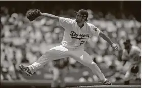  ?? MARK J. TERRILL / THE ASSOCIATED PRESS ?? Dodgers starting pitcher Clayton Kershaw helped Los Angeles to a 5-2 win over Kansas City on July 9.