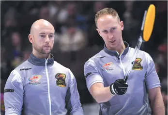  ?? CP FILE PHOTO ?? Skip Brad Jacobs, right, talks with third Ryan Fry during a game against Team Morris at the 2017 Roar of the Rings Canadian Olympic Curling Trials in Ottawa in December 2017.