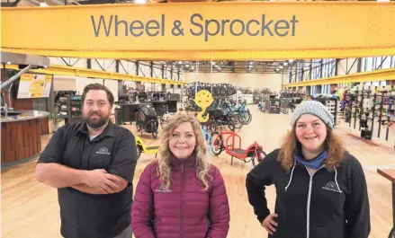  ?? JOURNAL SENTINEL MICHAEL SEARS / MILWAUKEE ?? The new Wheel & Sprocket location redevelope­d a former Bay View industrial building that includes an overhead crane. The company is led by Noel Kegel and his sisters Tessa Kegel and Amelia Kegel (left to right).