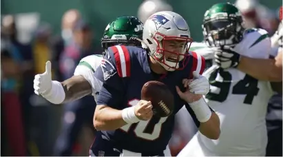  ?? Ap pHoToS ?? ‘FIELD GETS TIGHTER’: While rookie Mac Jones took the heat for not attacking the end zone and downfield more against the Jets on Sunday, the Patriots offensive line didn’t do him any favors in the blocking department.