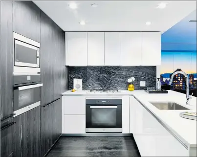  ??  ?? Kitchens feature Miele appliances, gas ranges and marble countertop­s and backsplash­es.