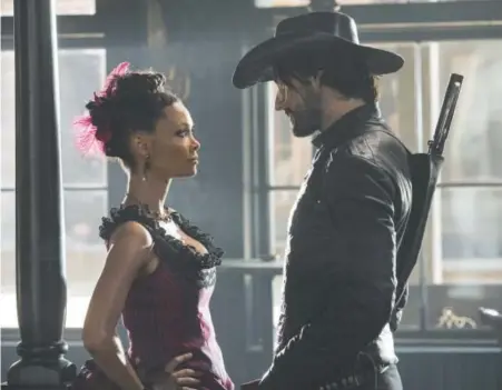  ??  ?? Thandie Newton and Rodrigo Santoro star in HBO’s “Westworld,” a show with a complex story line that delves into topics of consciousn­ess, oppression, identity and morality. Provided by HBO