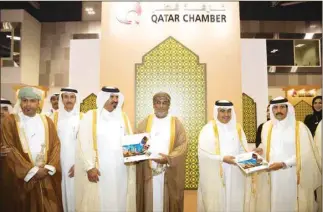  ??  ?? Qatar Chamber first vice-chairman Mohamed bin Towar al-Kuwari and second vice-chairman Rashid al-Athba presenting the book, Industry…Strategic Choice, to HE the Minister of Commerce and Industry Ali bin Ahmed al-Kuwari and Oman’s General Authority for Investment Promotion and Export Developmen­t president Yahia bin Saeed al-Jabri during the ‘Made in Qatar’ exhibition in Muscat.