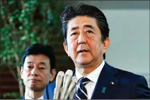  ?? AP/YOSHITAKA SUGAWARA ?? Japanese Prime Minister Shinzo Abe said Friday in Tokyo that Japan “will continue to closely coordinate with the U.S.” on security matters after the intelligen­ce-sharing break with South Korea.