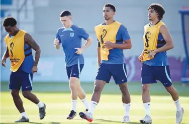  ?? Agence France-presse ?? From left: England’s Raheem Sterling, Phil Foden, Jude Bellingham and Trent Alexander-arnold take part in a training session on Monday.