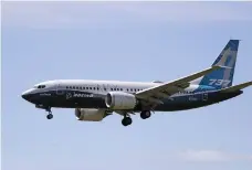  ??  ?? A Boeing 737 Max jet comes in to land at a Boeing air field after a test flight in June in Seattle