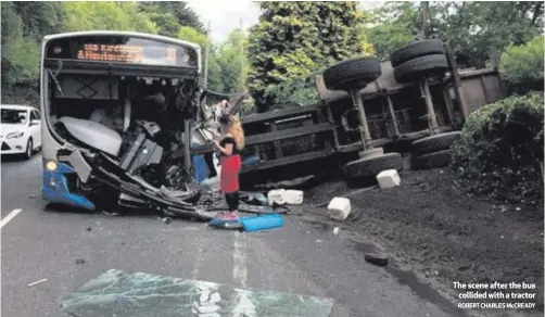  ??  ?? The scene after the buscollide­d with a tractorROB­ERT CHARLES McCREADY