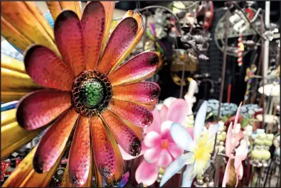  ?? University of Arkansas System Division of Agricultur­e/RYAN McGEENEY ?? Vendors will have whimsical as well as practical garden fixtures for sale along with plants and tools when the 2018 Arkansas Flower and Garden Show opens at the Arkansas State Fairground­s on March 2.