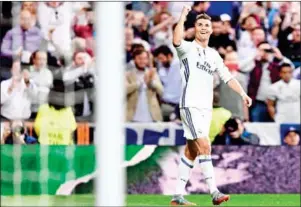  ?? JAVIER SORIANO/AFP ?? Real Madrid forward Cristiano Ronaldo celebrates his third goal in the UEFA Champions League semifinal first leg against Atletico Madrid on Tuesday night.