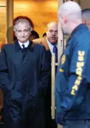  ?? KATHY WILLENS/THE ASSOCIATED PRESS FILE PHOTO ?? Convicted scam artist Bernard Madoff leaves a Manhattan courtroom after a bail hearing in January 2009. He is now serving a 150-year sentence.