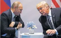  ?? EVAN VUCCI/ASSOCIATED PRESS FILE PHOTO ?? President Donald Trump meets with Russian President Vladimir Putin on Friday at the G-20 Summit in Hamburg. A US-Russiabrok­ered truce for southern Syria is meant to help allay growing concerns by neighborin­g Jordan and Israel about Iranian military...