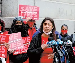  ?? ANTONIO PEREZ/CHICAGO TRIBUNE ?? Stroger Hospital nurse Consuelo Vargas speaks, along with other nurses and supporters, outside the Cook County downtown building after Board President Toni Preckwinkl­e delivered her 2021 budget on Thursday.