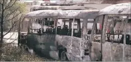  ?? United Nations ?? BURNED BUSES sit in a Damascus suburb. The fighting in and around the Syrian capital suggests that rebels may be trying to increase pressure in the city.