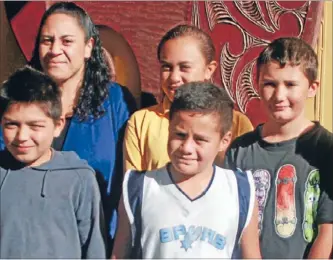  ??  ?? WELCOME: Tainui Full Primary School principal Tania Morrison with school pupils.