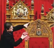  ?? PAWEL DWULIT/THE CANADIAN PRESS ?? A cleaner polishes the Senate thrones in Ottawa before a throne speech in 2010. Many Canadians would like to see the Senate get more than just a polishing.