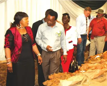  ??  ?? Mutare South Member of National Assembly as well as Minister of Women Affairs, Gender and Community Developmen­t, Cde Nyasha Chikwinya (left) exchanges note with TIMB chief executive officer, Dr Andrew Matibiri during the official opening of the 2017...