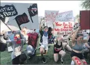  ?? Tony Gutierrez Associated Press ?? PROTESTS such as this one in Texas have prompted solidarity rallies and introspect­ion in other countries.