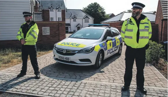  ?? Getty ?? Police at the scene on Muggleton Road, Amesbury, above, where a man and woman were exposed to the Novichok nerve agent. The couple, named as Dawn Sturgess, 44, left, and Charlie Rowley, 45, far left, are critically ill in hospital