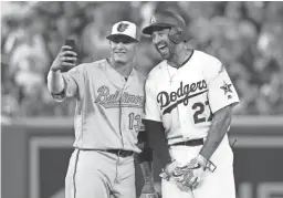  ?? GETTY IMAGES ?? Manny Machado, then of the Baltimore Orioles, and Matt Kemp of the Los Angeles Dodgers pose for a selfie in the second inning of the MLB All-Star Game on Tuesday in Washington.