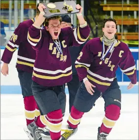  ?? SARAH GORDON/THE DAY ?? Eagles captain Zach Bradley celebrates with fellow captain Kevin Close as he carries the state championsh­ip plaque around the ice after Saturday’s 7-3 win over Tri-Town in the CIAC Division III hockey final at Yale University’s Ingalls Rink.