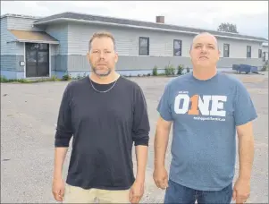  ?? JEREMY FRASER/CAPE BRETON POST ?? Jim Clark, left, and Brian Barron stand in front of the former Fairview school in North Sydney on Wednesday. Third Day Grace Ministries is hoping to purchase the building, where they plan to open a multipurpo­se centre, which will house an Undercurre­nt...