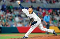  ?? WILFREDO LEE/ASSOCIATED PRESS FILE PHOTO ?? Japan’s Yoshinobu Yamamoto pitches during the fifth inning of a World Baseball Classic game against Mexico on March 20 in Miami. Yamamoto, the most prized pitcher on the free-agent market, has agreed to a $325 million, 12-year contract with the Los Angeles Dodgers, according to multiple reports.