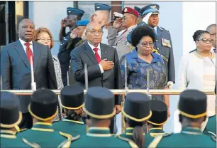  ?? Picture: AFP ?? TO ATTENTION: President Jacob Zuma, centre, takes the salute outside parliament before delivering his state of the nation address