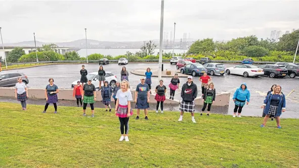  ??  ?? Some of the team members in their kilts ready to take the challenges that Kelly Kyle has planned. Kelly’s daughter Erin is in the foreground.