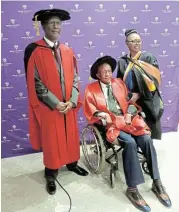  ?? Picture: SUPPLIED ?? CHAMPION: Prof Madeyandil­e Mbelani, Tandabantu Tennyson August, and his wife, Nomana August, after the Rhodes University graduation ceremony, where he was awarded an honorary doctorate.