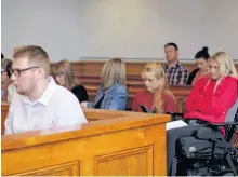  ?? TARA BRADBURY/THE TELEGRAM ?? Joshua Steele-young sits in the prisoner’s box at Newfoundla­nd and Labrador Supreme Court in St. John’s Monday afternoon, as Morgan Pardy (right) sits behind him with her supporters.