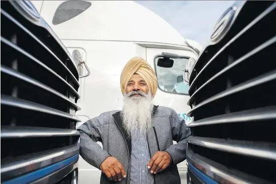  ?? COLE BURSTON/ THE CANADIAN PRESS ?? Nachhattar Singh Chohan runs a 20-tractor fleet for regional and long-haul freight based in Mississaug­a, Ont. South Asian Canadians are filling a growing labour shortage in the trucking industry that was once the domain of white, blue-collar big-riggers. Decent salaries and a low barrier to entry are draws for jobseekers.