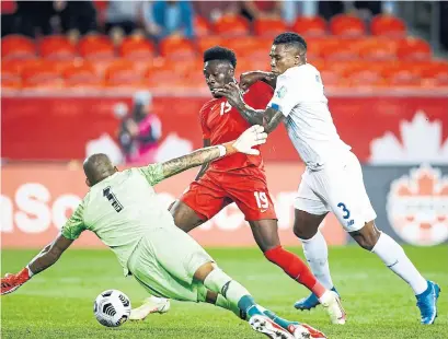  ?? VAUGHN RIDLEY GETTY IMAGES ?? The pace of Alphonso Davies, battling for the ball with Harold Cummings, right, and Luis Mejia, was too much for Panama.