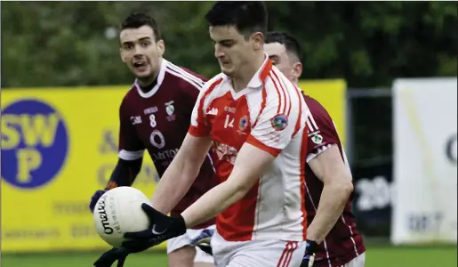  ??  ?? Shamrock Gaels’ Paul Higgins moves in to tackle Castleconn­or forward Brian Howley at Tourlestra­ne last Saturday. Pic: Tom Callanan.