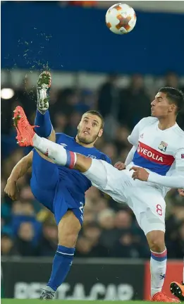  ??  ?? Nikola Vlasic (left) of Everton vies for the ball with Lyon’s Houssem Aouar.