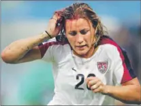  ?? Ronald Martinez Getty Images ?? ABBY WAMBACH dismisses the danger: “I feel OK. I love what I do. I don’t think it’s harmful to me or my body.”
