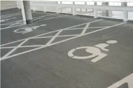  ??  ?? Disabled parking spaces at Carnival Pool have been moved from next to the leisure centre’s entrance to the new multi-storey car park, making it harder for disabled people to use