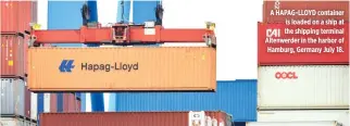  ??  ?? A HAPAG-LLOYD container is loaded on a ship at the shipping terminal Altenwerde­r in the harbor of Hamburg, Germany July 18.